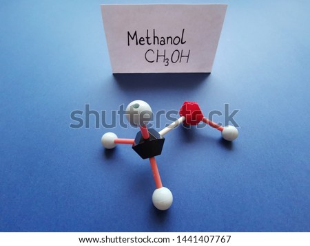 Molecular structure model and structural chemical formula of methanol molecule. CH3OH, ball-and-stick model and skeletal formula. Black=C, red=O, white=H.