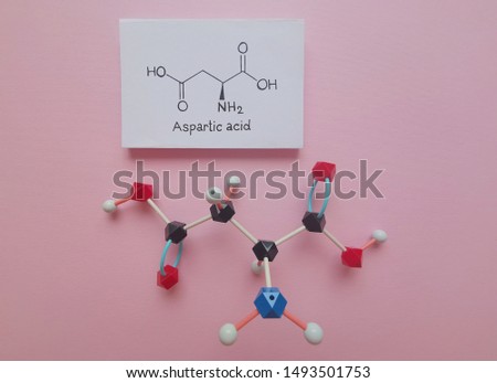 Molecular structure model and structural chemical formula of aspartic acid molecule. Aspartic acid (Asp, D, aspartate) is an α-amino acid that is used in the biosynthesis of proteins.