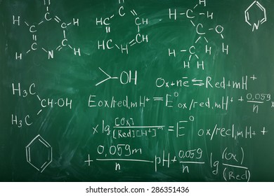 Molecule models and formulas on blackboard background - Powered by Shutterstock