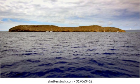 The Molokini Crater Is A Partially Submerged Volcanic Crate Off The Island Of Maui. It Is A Popular Dive And Snorkel Destination