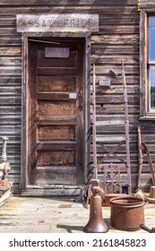 Molson, WA - USA: 05-10-2022: Old Rusty Tools Line The Entry Way To The Assay Office