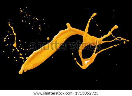Molten caramel splash with drops on black background