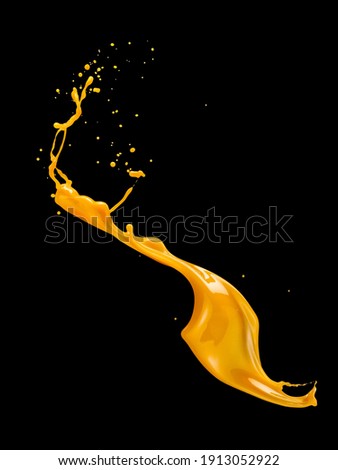 Molten caramel splash on black background