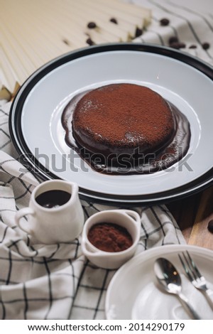 molten chocolate cake on white plate and choc chip