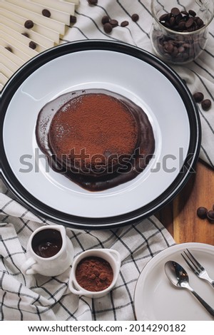 molten chocolate cake on white plate and choc chip