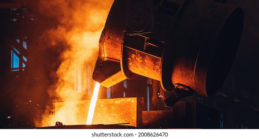Molten Metal Pouring From Big Ladle. Iron Cast Process.Metallurgical Plant. Steel Mill Factory