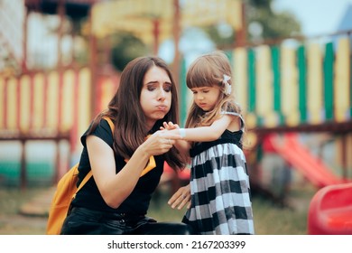 
Mom Applying A Pasture On An Injured Daughter At The Playground. Sad Wounded Child Receiving First Aid From Her Mother
