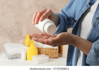 Mom Applying Talc Powder From Plastic Tube. Baby Hygiene