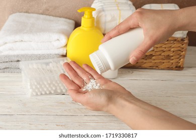 Mom Applying Talc Powder From Plastic Tube. Baby Hygiene