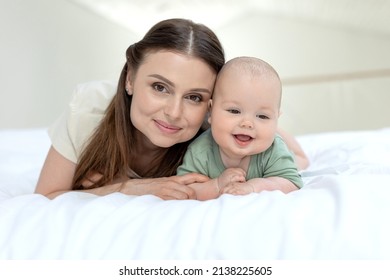 Mom and baby. Beautiful woman with a baby at home. High quality photo