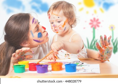 Mom And Baby Draws With Colored Inks Paint. Games With Child Affect Early Development. Important To Spend Enough Time With Your Kids.