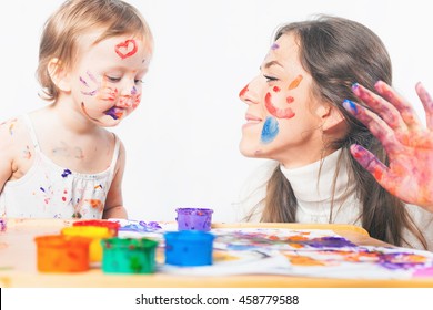 Mom And Baby Draws With Colored Inks Paint. Games With Child Affect Early Development. Important To Spend Enough Time With Your Kids.