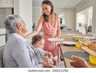 Mom, Baby And Grandmother Eating At Table, Bonding And Sharing Food And Love At Home. Happy, Smile And Relax Women Bonding While Having A Meal, Enjoying Family Time And Being Loving And Caring