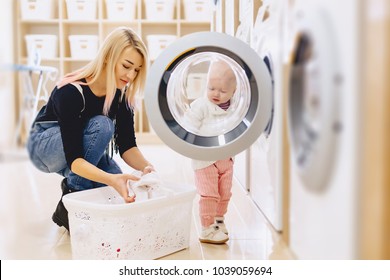 Mom And Baby In The Laundry Take Things And Play Fun Games