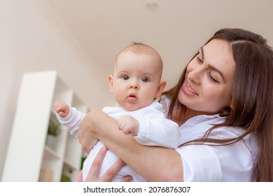 Mom And Baby Are Messing Around At Home, Baby Is Flying