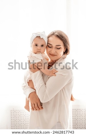 Similar – Image, Stock Photo Young woman holding cute baby girl in the autumn park