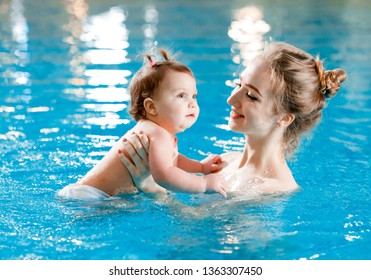 Mom And Baby Swim In The Pool