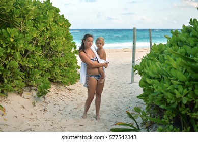 Mom and a boy on the beach, Playa del Carmen, Xcacel beach, Mexico