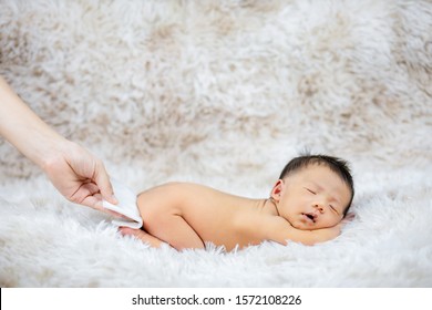 Mom Changing Diaper To Baby