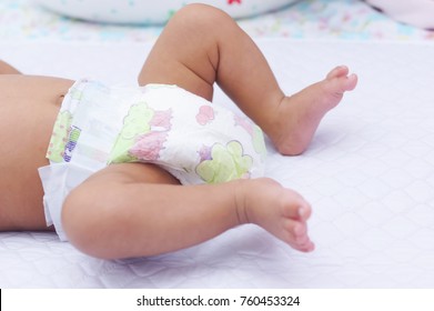 Mom Changing Her Cute Baby Diaper , Close Up