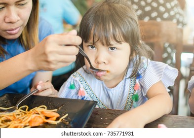 Mom And Child Eating Spaghetti In Morning Time