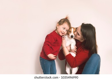 Mom With Child And Pet Dog Have A Fun At Home