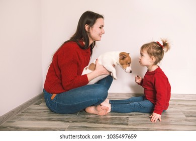 Mom With Child And Pet Dog Have A Fun At Home