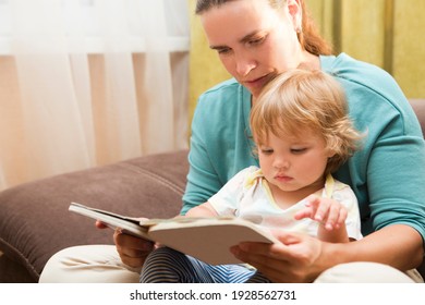 Mom And Child Reading A Book Free Time Weekend Together At Home