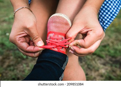 Mom Child Tying Shoelaces