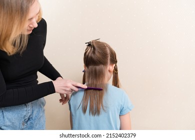 Mom Combs Her Daughter's Wet Hair Before Cutting. Cutting Hair At Home. Life Hacks And Rules Of Hair Care. Special Combs And Scissors For Hairdressers.