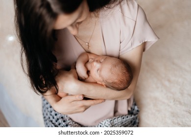 mom cradling a newborn baby. concept of motherhood. - Powered by Shutterstock