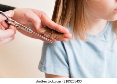 Mom Cuts Daughter's Wet Hair. Cutting Hair At Home. Life Hacks And Rules Of Hair Care. Special Combs And Scissors For Hairdressers.