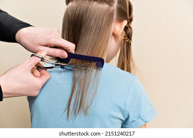 Mom Cuts Her Daughter's Wet Hair. Cutting Hair At Home. Life Hacks And Rules Of Hair Care. Special Combs And Scissors For Hairdressers.