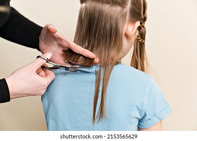 Mom Cuts Her Daughter's Wet Hair. Cutting Hair At Home. Life Hacks And Rules Of Hair Care. Special Combs And Scissors For Hairdressers.