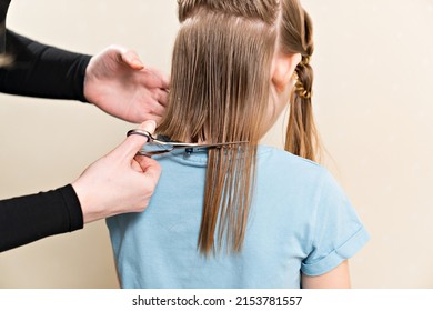 Mom Cuts Her Daughter's Wet Hair. Cutting Hair At Home. Life Hacks And Rules Of Hair Care. Special Combs And Scissors For Hairdressers.