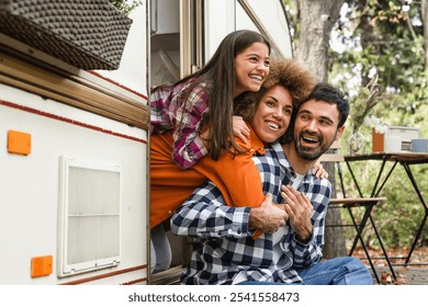 Mom dad and daughter family driving van home on wheels camper together. Adventure on caravanning. Road trip voyage with children kids - Powered by Shutterstock