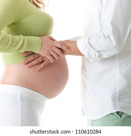 Mom And Dad With Hands On The Baby Over White Background