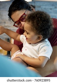 Mom And Dad Playing With Little Girl