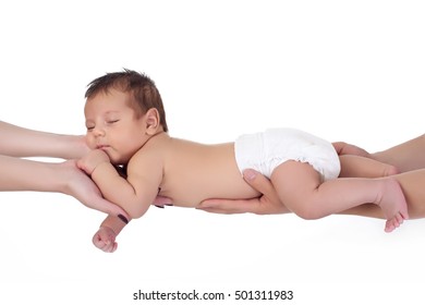 Mom And Dad Take Care Of The Child. Newborn Baby Boy Asleep In The Arms Of Their Parents.