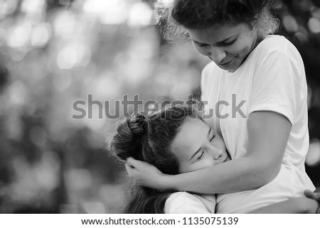 mom and daughter happy together / family happiness cheerful mom with daughter smiling