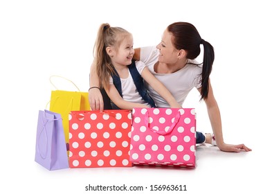 Mom And Daughter With A Lot Packages With Shopping