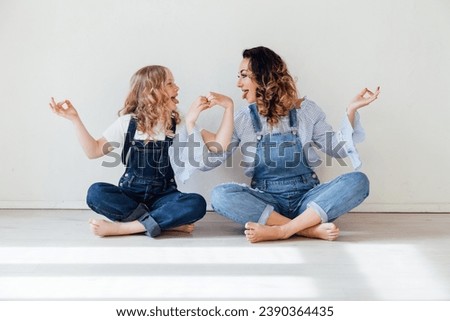 Mom and daughter show grimaces in a bright room Stock photo © 