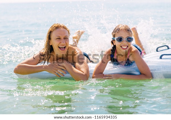 mommy daughter swim