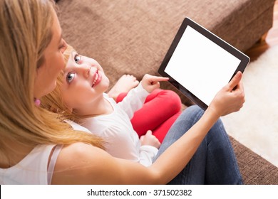 Mom and daughter using tablet 