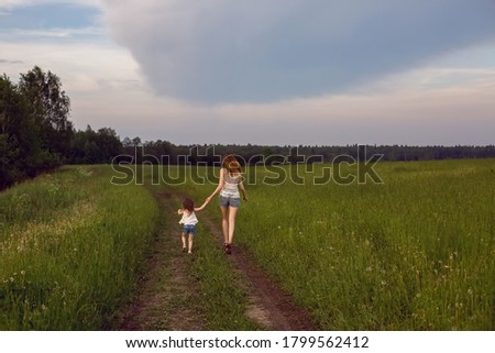 Similar – Attractive smiling blond woman with her two dogs