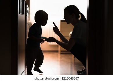 Mom disciplining her child. Teaching-parenting your kid concept. 
