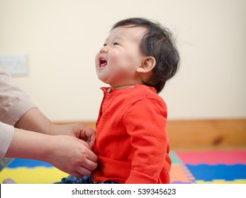 MOM Dressing Her Baby Girl