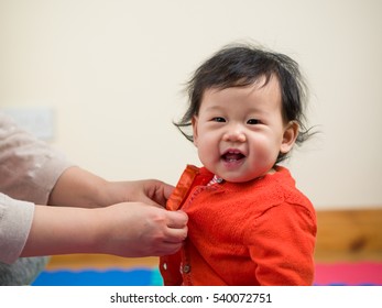 MOM  Dressing Her Baby Girl