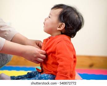 MOM  Dressing Her Baby Girl