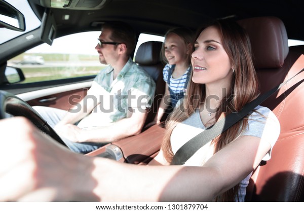 mom driving a family\
car
